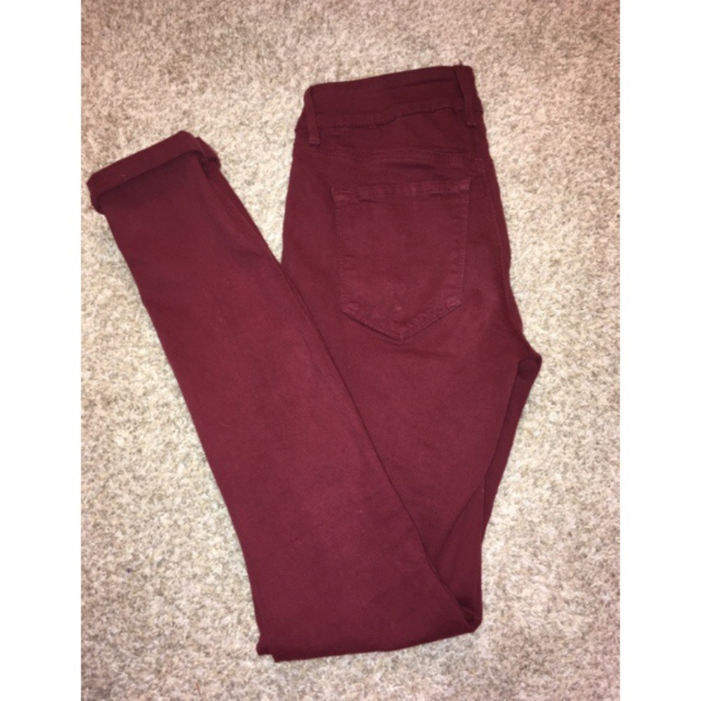 Maroon jeans.